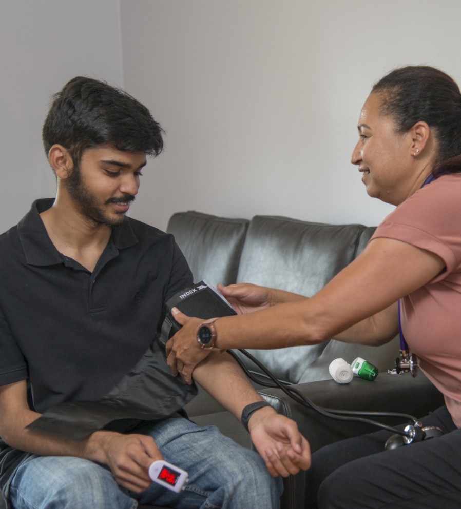NDIS Support Worker Checking Client's Vital Signs