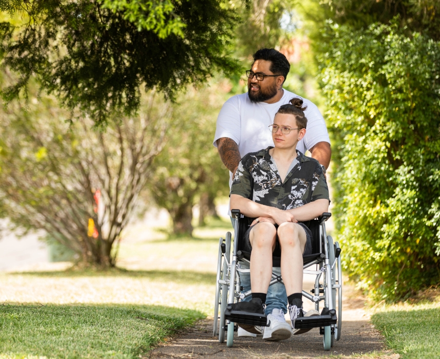 Mental Health Staff Pushing Young Man on a Wheelchair