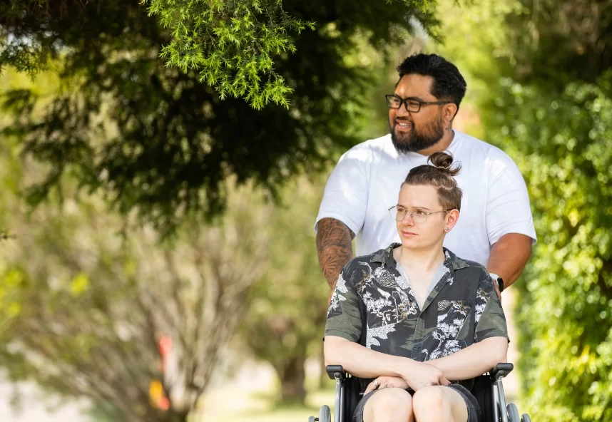 Mental Health Staff Pushing Young Man on a Wheelchair