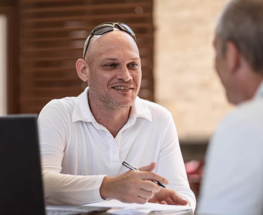 Elderly Man Consulting a Community Justice Staff