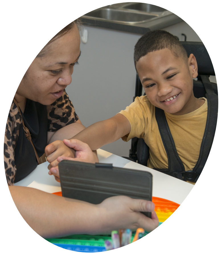 Woman Showing a Video to a Child