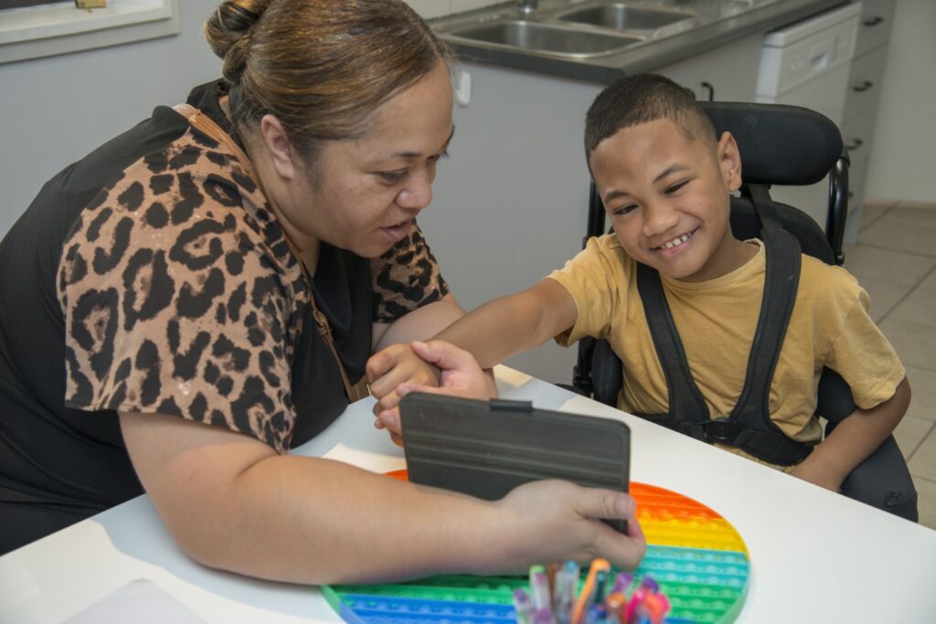 Woman Showing a Video to a Child