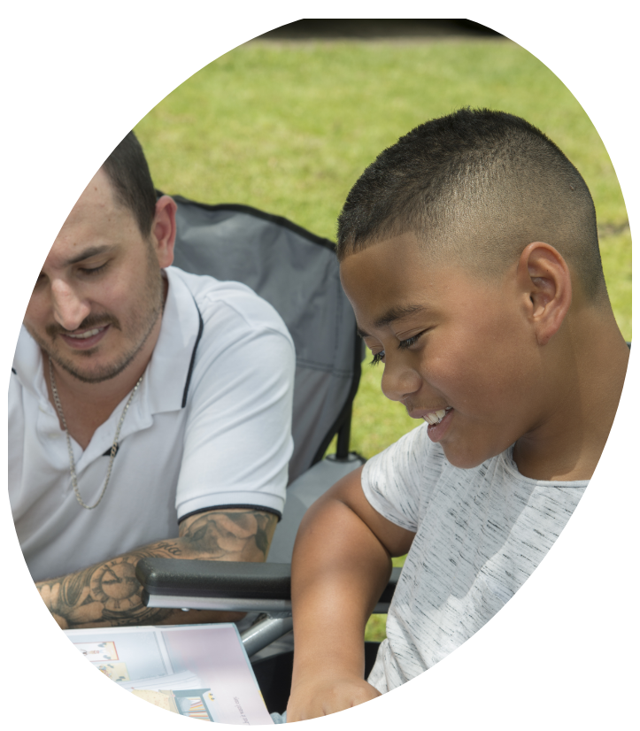 NDIS Staff Teaching Kid to Read