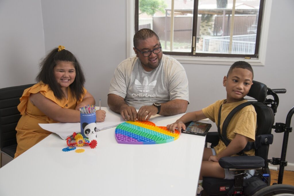 Kids Doing a Learning Activity with NDIS Staff